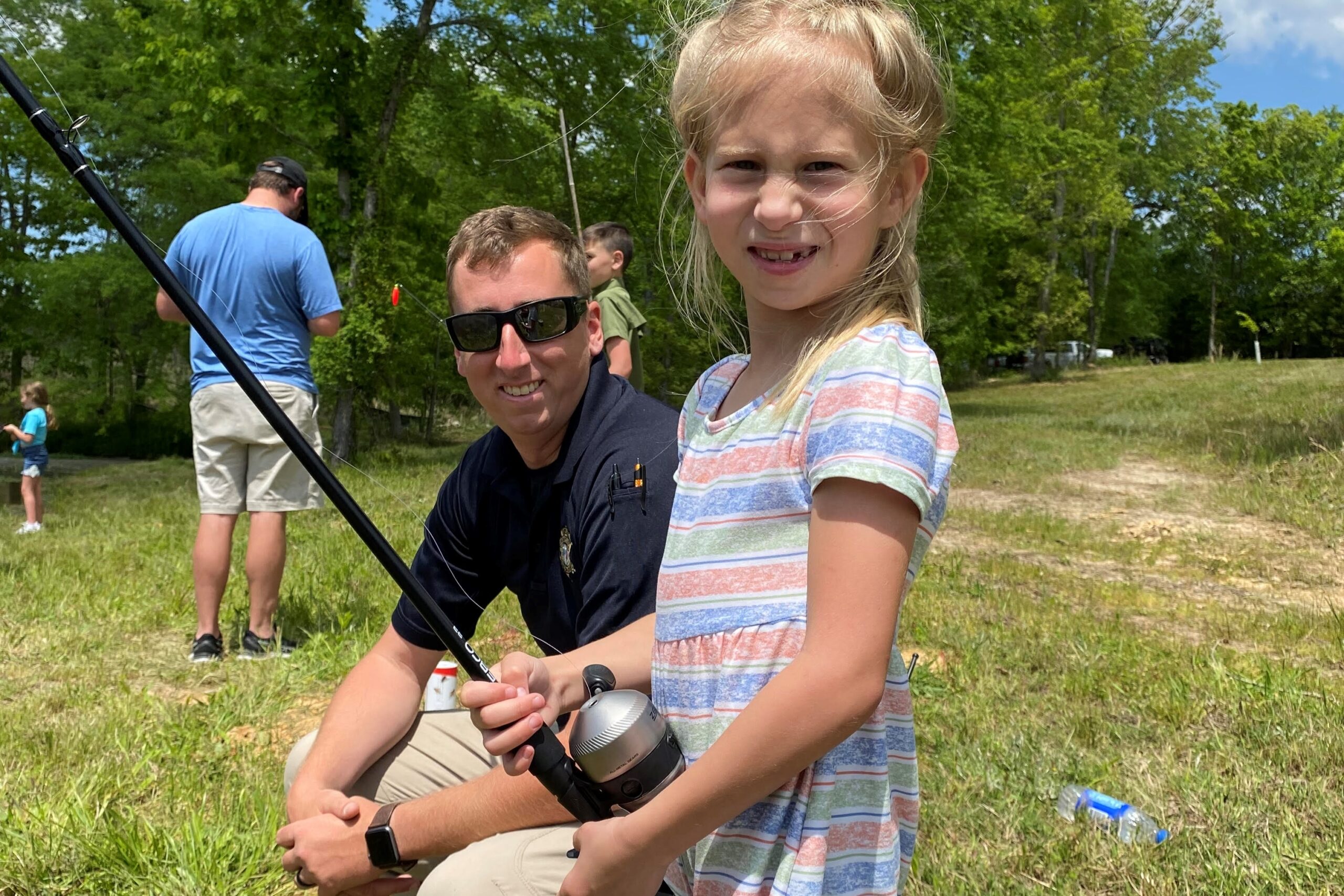 deputy and daughter fishing