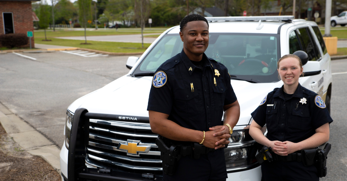 Sgt. Willie Harris poses with one of his fellow deputies before they begin a patrol shift in Lexington County, South Carolina